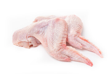 Raw chicken wings with skin on a white background.