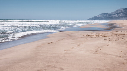 Fototapeta na wymiar The wide Patara beach on the Mediterranean coast with sand dunes in Turkey