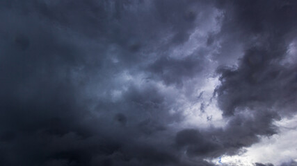 Obraz premium The dark sky had clouds gathered to the right and a strong storm before it rained.Bad or moody weather sky.