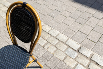 Bistro chair on the sidewalk outside a café