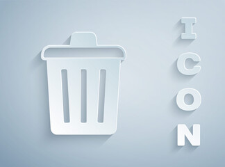 Paper cut Trash can icon isolated on grey background. Garbage bin sign. Recycle basket icon. Office trash icon. Paper art style. Vector