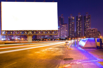 blank billboard on light trails, street, city and urban in the night - can advertisement for...