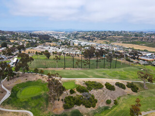 Fototapeta na wymiar Aerial view of golf course surrounded by houses. Oceanside, California, USA 