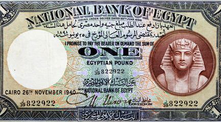 one Egyptian pound banknote 1940 with the portrait of the pharaoh Tutankhamen. The words 'national...