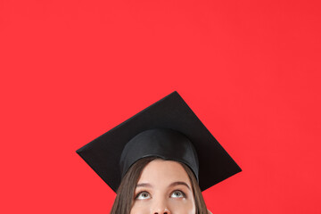 Female graduating student on color background