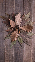 autumn leaves on wooden background