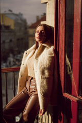 Young woman wearing stylish trendy bomber jacket. Casual outfit. 