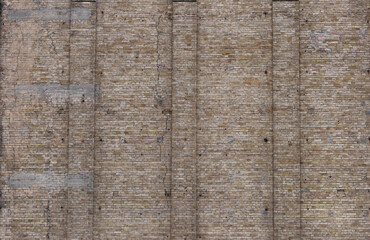 Texture of a brick wall with cracks. Facade of an old building