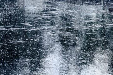 Black asphalt in heavy rain
