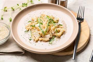 Plate with tasty pasta on table, closeup