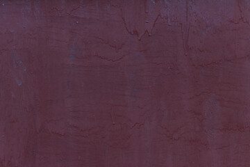 Pink painted metal wall with paint drips