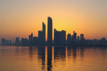 Tuinposter Abu Dhabi city skyline at sunrise  © Baskaran