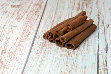 cinnamon sticks on wooden table