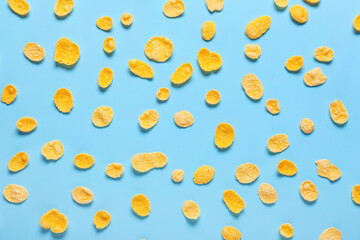 Tasty corn flakes on color background