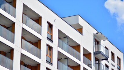 Fragment of modern luxury residential apartment,  home house building concept. Modern apartment building on a sunny day with a blue sky.