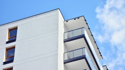 Fragment of modern luxury residential apartment,  home house building concept. Modern apartment building on a sunny day with a blue sky.