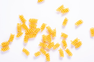raw pasta scattered on a white background, minimalistic