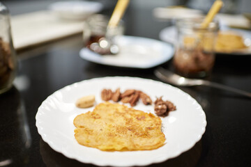Photography oh a banana pancake in a white plate