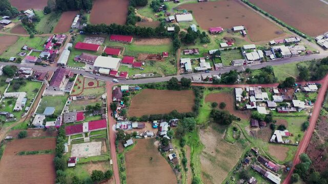 Aerial view of houses and harvest fields in the village