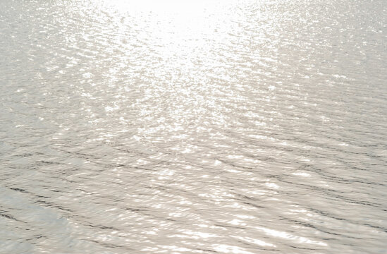 solar reflex on the water during the day. River water texture