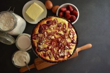 sour strawberry cake.Ingredients in a cake yogurt, flour, yeast, sugar, eggs, butter