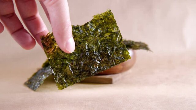 Japanese food nori dry seaweed or edible seaweed close-up.