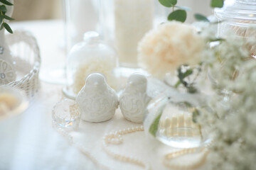porcelain toys, porcelain birds, white birds, two figurines, two birds, white table setting, romance