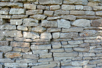 Old wall built of natural stone