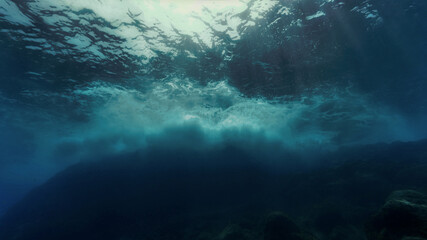 Fototapeta na wymiar Dramatic and stormy waves underwater