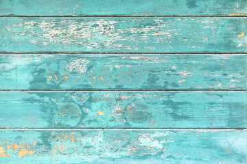 Background with wooden teal blue colored old weathered planks with chipped paint