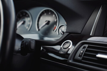 Obraz na płótnie Canvas Start stop engine modern new car button.