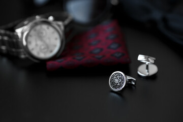 Obraz na płótnie Canvas Business accessories. Luxury Men's cufflinks with watch, breastplate and sunglasses close up.