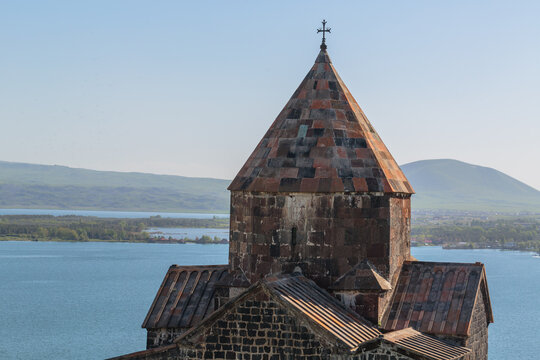 church of sevanavank in armenia against the backdrop of lake of sevan and sky
