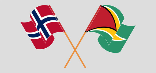 Crossed and waving flags of Norway and Guyana