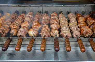 Cooking on the grill over charcoal Fresh tasty barbecue pork on skewers