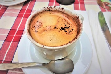 Italian coffee. cup of cappuccino with chocolate