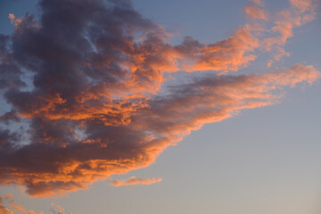 Sky with orange clouds at sunset