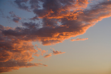 Sky with orange clouds at sunset