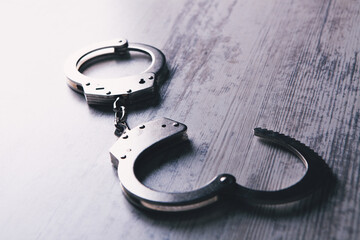 handcuffs on a wooden table