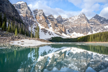 Lake Moraine and reflection of Canadian Rocky Mountains of the Ten Peaks Valley in Banff National Park