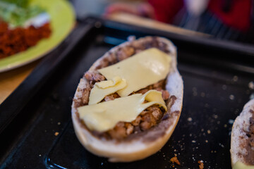 Close-up of traditional Mexican molletes on a black tray