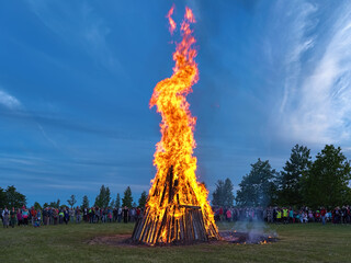 Kuressaare, Saaremaa island, Estonia. Traditional large bonfire to celebrate the Jaanipaev (Jaan's Day). This Estonian public holiday corresponds to the English Midsummer Day. - 438522813