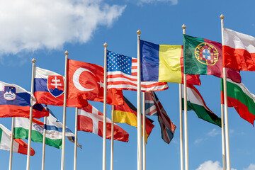 Group of flags of various states - as a symbol of world cooperation. Flags of the countries of the...