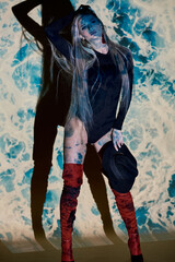 Abstract portrait of a beautiful girl in the light of the projector.