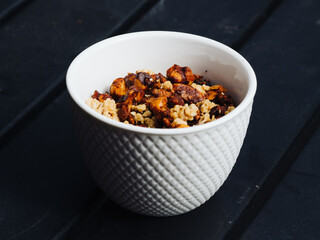 Granola and nuts in a ceramic bowl