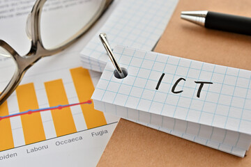 There is a word book with the word of ICT which is an abbreviation for Information and...