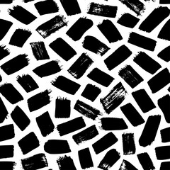Obraz premium Brush strokes vector seamless pattern. Chaotic rough short smears. Black paint freehand scribbles. Grungy daub, messy brush strokes on white background. Hand drawn grunge ink illustration.