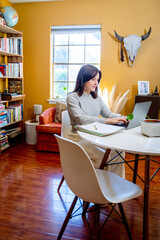 Woman working from home on laptop