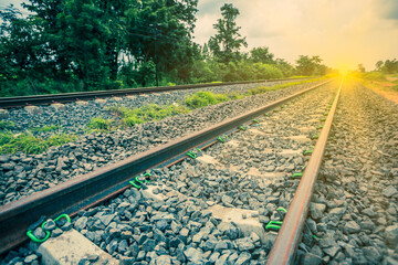 Railway tracks in a rural scene with sunbeam..