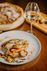 Chicken parmigiana. Traditional Italian comfort dish. Chicken breast covered in breadcrumbs fried, topped with marinara sauce, melted mozzarella, parmigiana and provolone cheeses and Italian parsley.